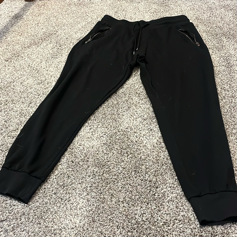 These are some women’s lounging pants, size medium. With some gold zippers.